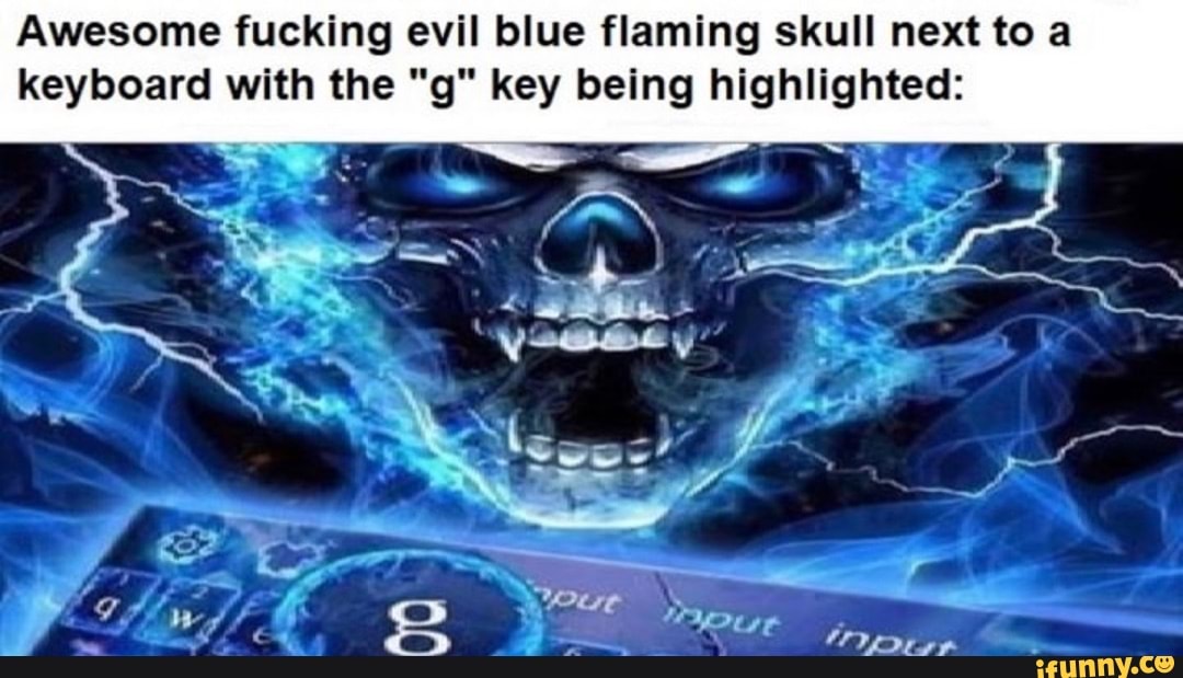 Awesome fucking evil blue flaming skull next to a keyboard with the "g