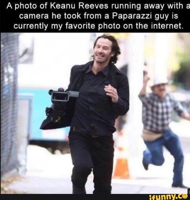 A photo of Keanu Reeves running away with
a
camera he took from a Paparazzi guy is
currently my favorite photo on the internet.
