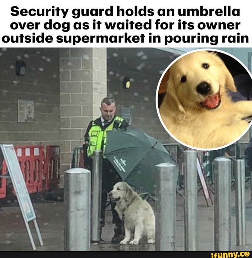 Security guard holds an umbrella over dog as it waited for its owner outside supermarket in pouring rain