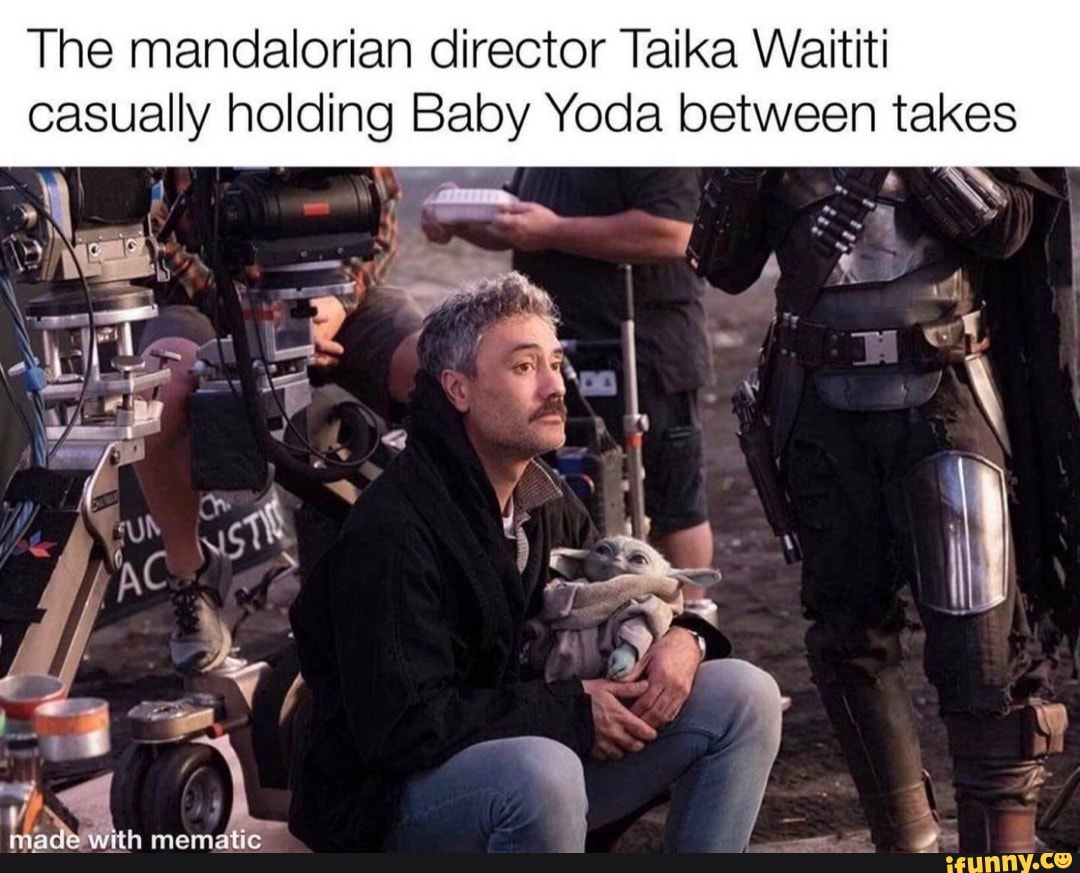 The mandalorian director Taika Waititi
casually holding Baby Yoda between takes