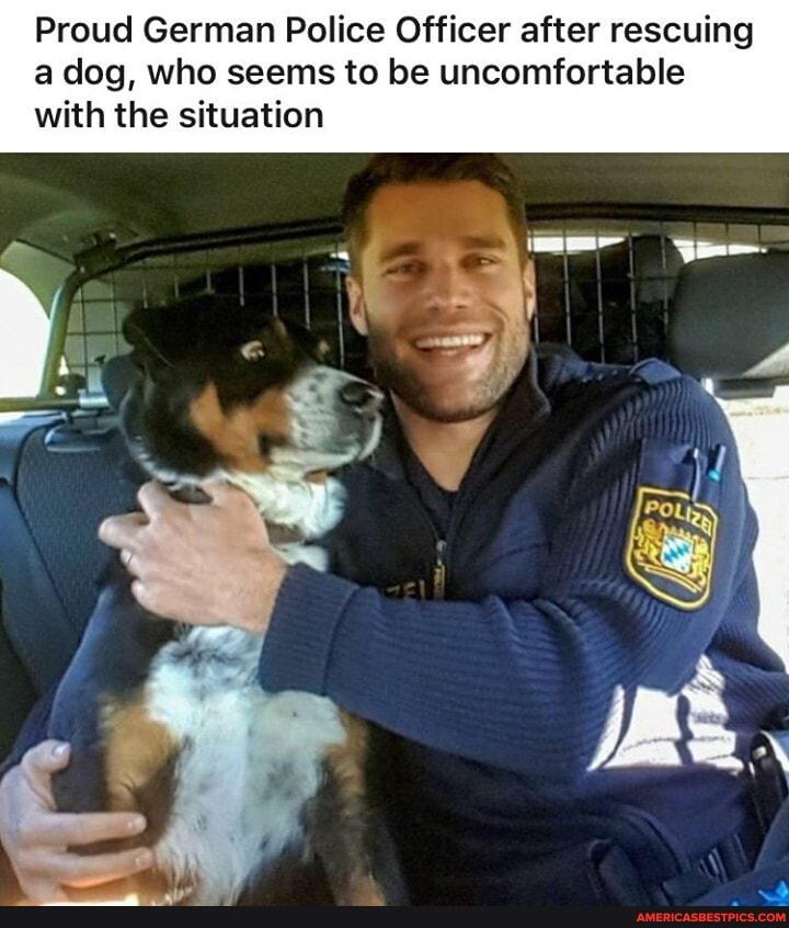 Proud German Police Officer after rescuing a dog, who seems to be uncomfortable with the situation