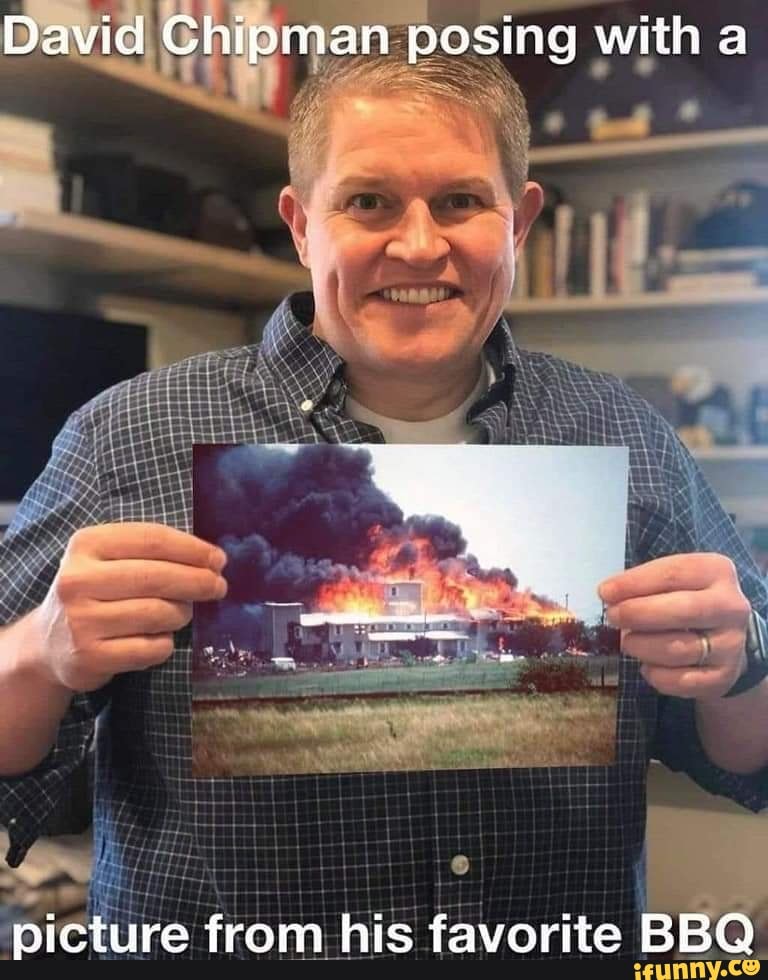 David Chipman posing with a picture from his favorite BBQ - )