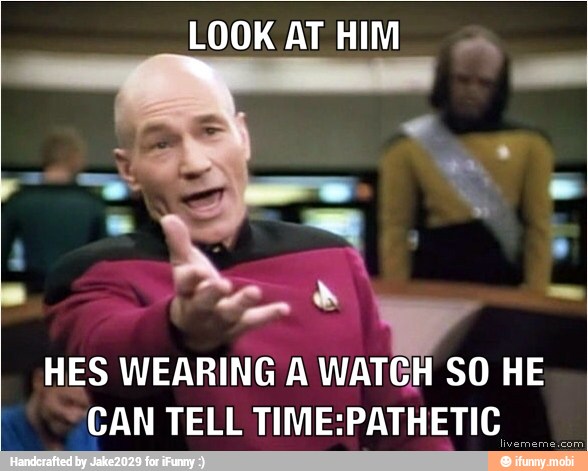 LOOK AT HIM.
A
HES WEARING A WATCH SO HE
CAN TELL TIME:PATHETIC