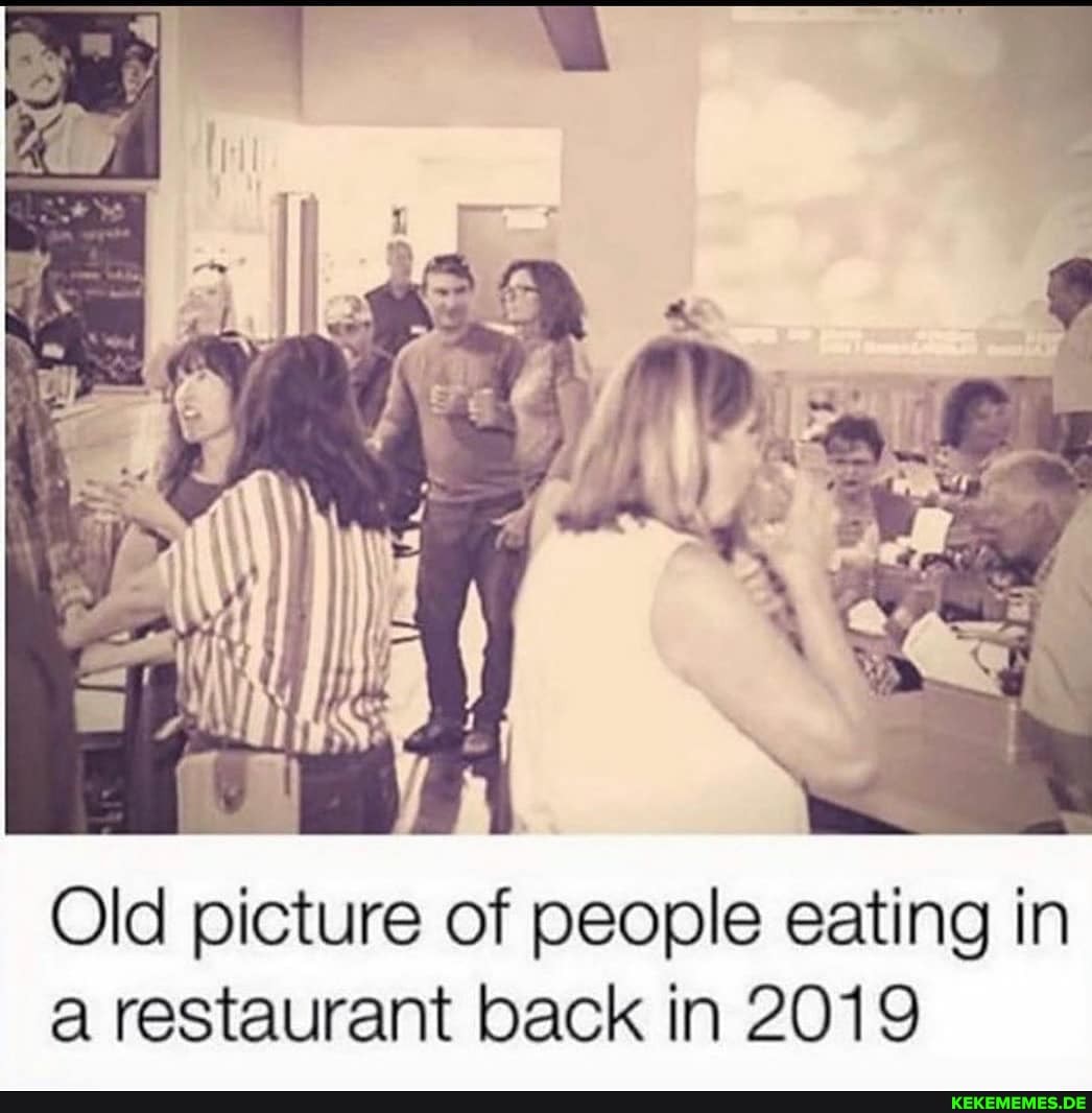 Old picture of people eating in a restaurant back in 2019