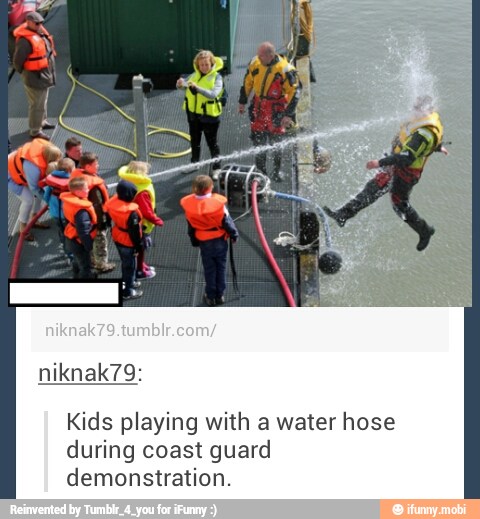 Kids playing with a water hose
during coast guard
demonstration.