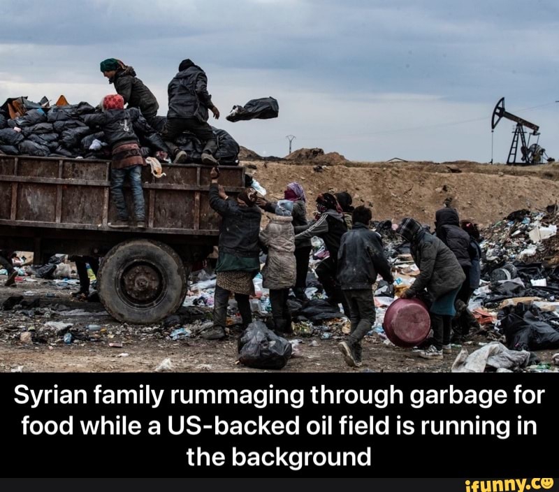 Syrian family rummaging through garbage for food while a US-backed oil field is running in the background - Syrian family rummaging through garbage for food while a US-backed oil field is running in the background