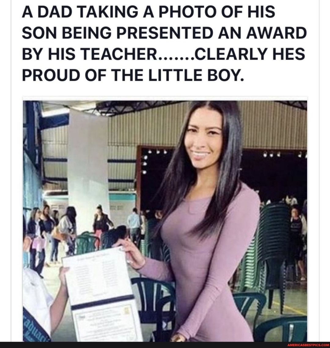 A DAD TAKING A PHOTO OF HIS SON BEING PRESENTED AN AWARD BY HIS TEACHER....... CLEARLY HES PROUD OF THE LITTLE BOY.
ES
SAL
Uh