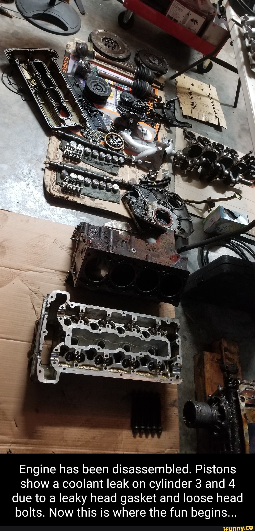 Engine has been disassembled. Pistons show a coolant leak on cylinder 3