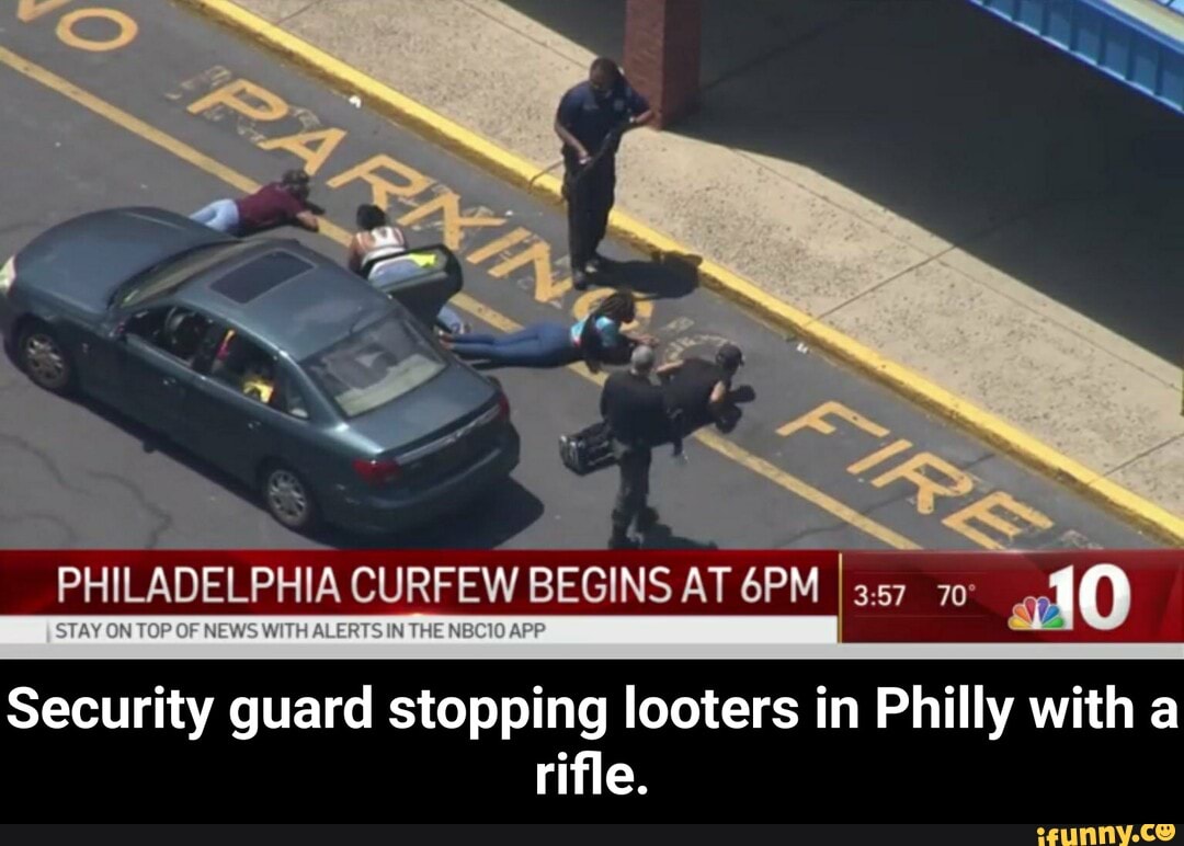 I
Security guard stopping looters in Philly with a
rifle. - Security guard stopping looters in Philly with a rifle.
