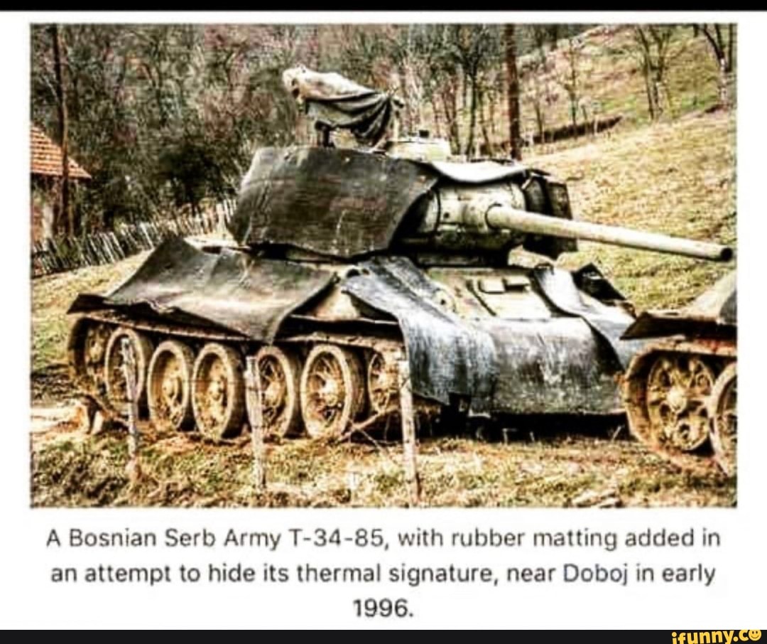 A Bosnian Serb Army T-34-85, with rubber matting added in
an attempt to hide its thermal signature, near Doboj in early
1996.