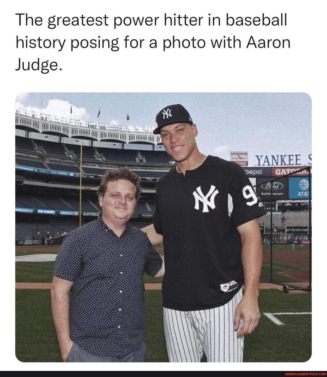 The greatest power hitter in baseball history posing for a photo with